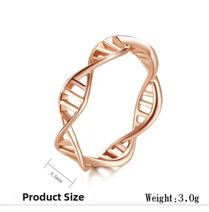 Macro detail of rose gold DNA double helix ring with 5.5mm band width and polished finish