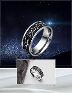 Close-up of retro titanium steel dragon ring with polished black mirror finish