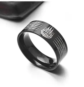 Close-up of black stainless steel ring with laser-engraved Thai Buddhist scriptures