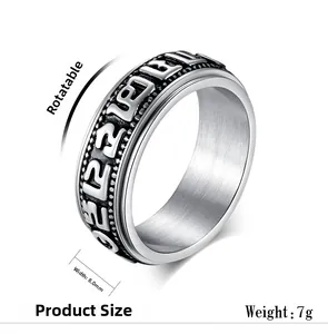 Macro view of 8mm rotatable spinner ring featuring engraved Buddhist characters