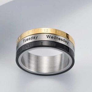 Three-layer rotating calendar ring in gold silver and black with roman numerals