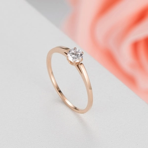 Elegant rose gold minimalist ring featuring a brilliant round zircon in a six-prong setting