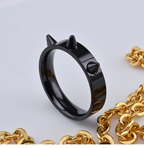 Hip hop style black rivet ring with 18k gold chain accent for a punk gothic jewelry look