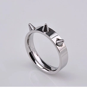Polished silver punk ring with three conical metal spikes and high mirror finish