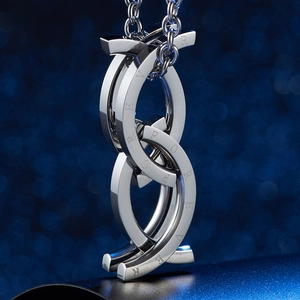 Macro shot of interlocking polished steel rings featuring FOREVER engraving detail