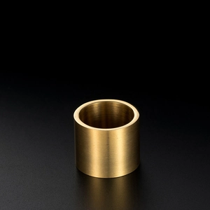 Macro detail of brushed 18K gold-plated titanium steel ring with matte texture