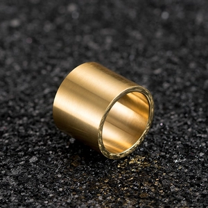 Macro shot of brushed 18K gold plated titanium steel ring with smooth inner surface