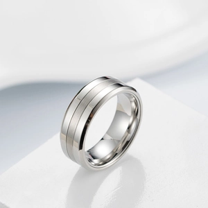 Macro view of silver ring featuring brushed matte center and polished mirror edges