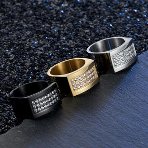 Detailed close-up of 18K gold plated punk style signet rings with three rows of CZ stones