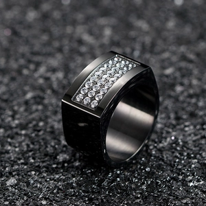 Detail of black wide men's ring with three rows of clear cubic zirconia inlay
