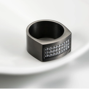 Macro shot of brushed titanium steel ring with three rows of micro-pave crystals