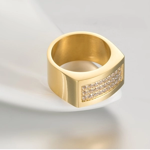 Macro shot of 18K gold-plated men's ring featuring three rows of sparkling zircon stones