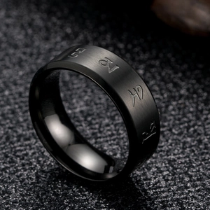 Black brushed stainless steel ring featuring engraved religious mantra symbols