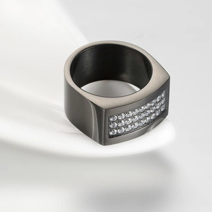 Close-up of gun black plated men's ring with micro-pave crystals and brushed metal finish