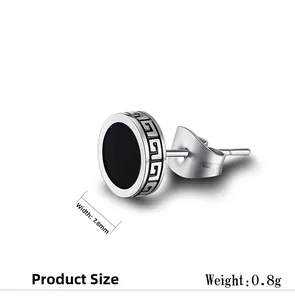 Detail view of round silver stud earring with black center and Greek fret patterns