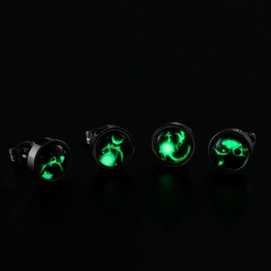 Glow in the dark constellation stud earrings in stainless steel with green nebula pattern