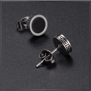 Vintage steel stud earrings with black vinyl face and Greek key pattern engraving