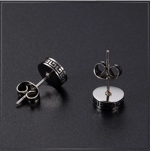 Vintage silver Greek meander pattern stud earrings for men with polished metal finish