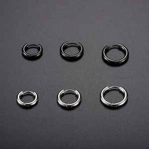 Polished stainless steel huggie hoop earrings in black and silver finishes, three sizes set