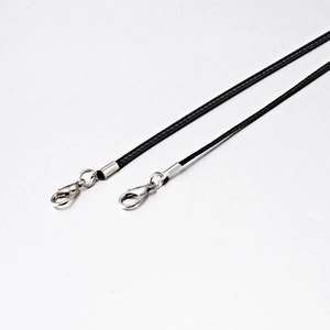 Close-up of black braided wax cord necklaces with silver lobster clasps in 1.5mm and 2.0mm
