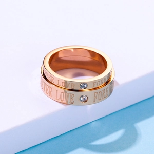 Rose gold Forever Love couple rings set with cubic zirconia stones in minimalist style