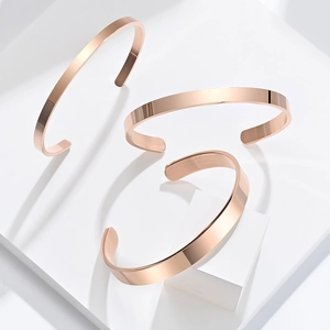 Set of three rose gold stainless steel open bangles with high-polished mirror finish