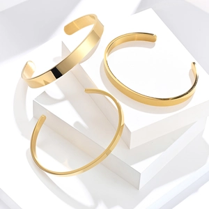 Three-piece gold stainless steel open bangles set in various widths with mirror finish
