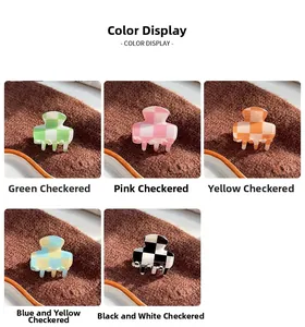 Close-up of checkerboard acetate hair claws in green, pink, orange, blue and black colors