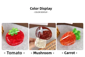 Drei kreative Haarklammern in Form von Tomaten, Pilzen und Karotten aus Acetatmaterial