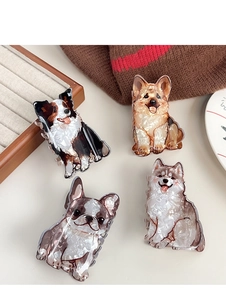 Detailed view of acetate hair claws featuring Corgi and Border Collie dog designs