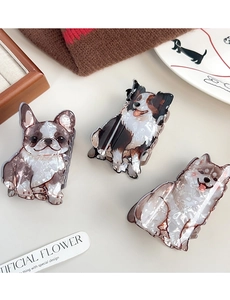 Detailed view of Bulldog Border Collie and Husky dog-shaped hair claws on a cozy sweater