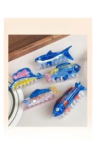 Detailed view of colorful ocean animal hair claw clips with marble texture patterns