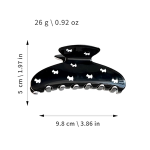 Hollow out dog pattern hair claw clip in black with product dimensions and weight