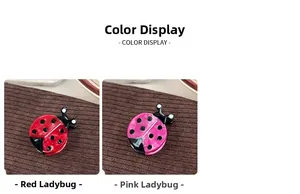 Detail view of ladybug acetate hair clips in red and rose pink with glossy spotted finish