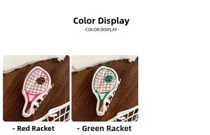 Detailed comparison of red and green tennis racket hair claws on a rustic wooden desk