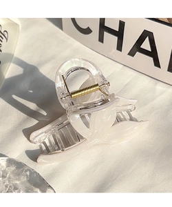 Detailed view of iridescent mermaid tail hair claw clip with golden metal spring