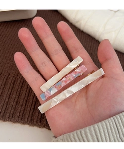 Three-piece set of tortoiseshell acetate hair clips with cream and marble textures