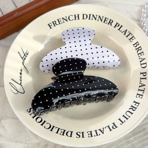 Polka dot hair claw clip set in black and white finish for elegant hairstyling