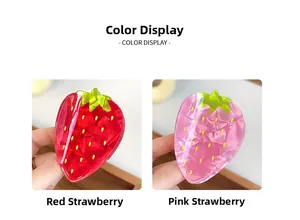 Detail showing red and pink strawberry hair claws with glossy finish and yellow dot seeds