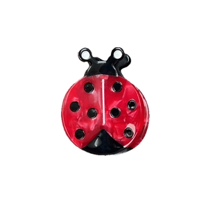 Red ladybug hair clip in acetate resin with black polka dots and marble texture