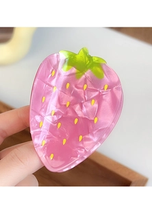 Detailed close-up of pink strawberry hair claw clip with glossy marble texture finish