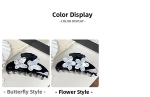 Detail of elegant black acetate hair claws with pearlescent butterfly and floral motifs