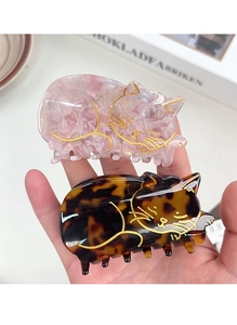 Dettaglio di fermagli per capelli a forma di gatto in acetato rosa perlato e tartarugato