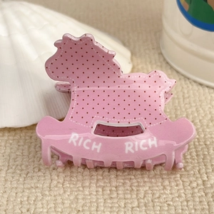 Molla per capelli a forma di cavallo a dondolo rosa con pois rossi e scritta RICH