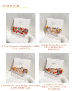 Colorful acetate hair clips in rectangular and water drop shapes on a display card