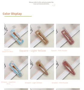 Detail of acetate hair clips in drop and square shapes with marble and glitter textures