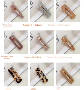 Detailed macro view showing teardrop and square acetate hair clips in assorted glitter colors
