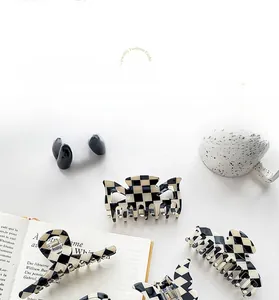 Set of black and white checkerboard acetate hair claws in various vintage French styles