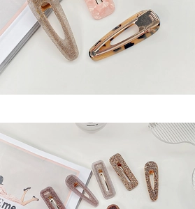 Close-up of acetate hair clips in leopard print, glitter gold, and marble patterns