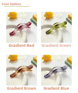 Four gradient frosted banana hair clips in red, green, brown, and blue colors
